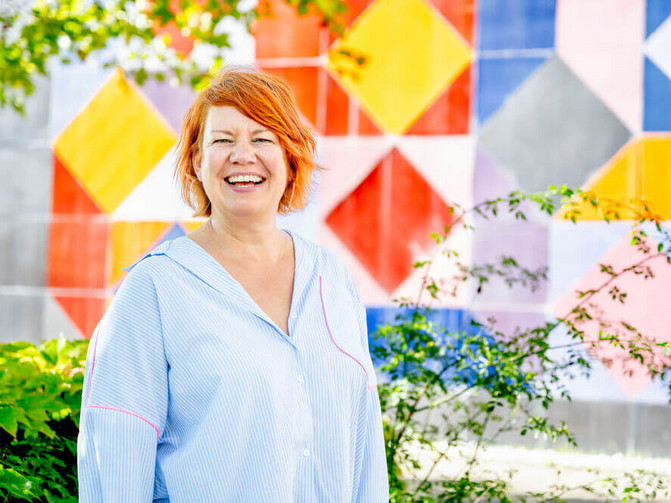 The image is a portrait of Prof. Dr Katrin Marcus-Alic, Head of the Proteome Center at Ruhr University Bochum.