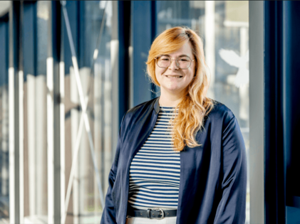 The image is a portrait photograph of Janin Rösner, Research Officer at the Faculty of Medicine at Ruhr University Bochum.